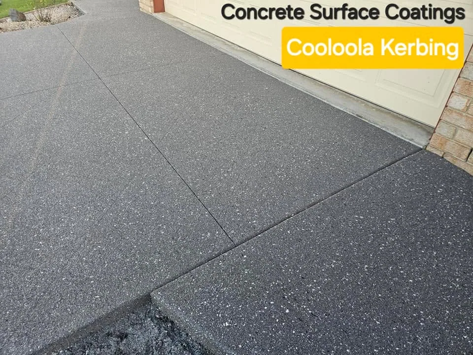 Textured grey concrete coating beside a brick wall
